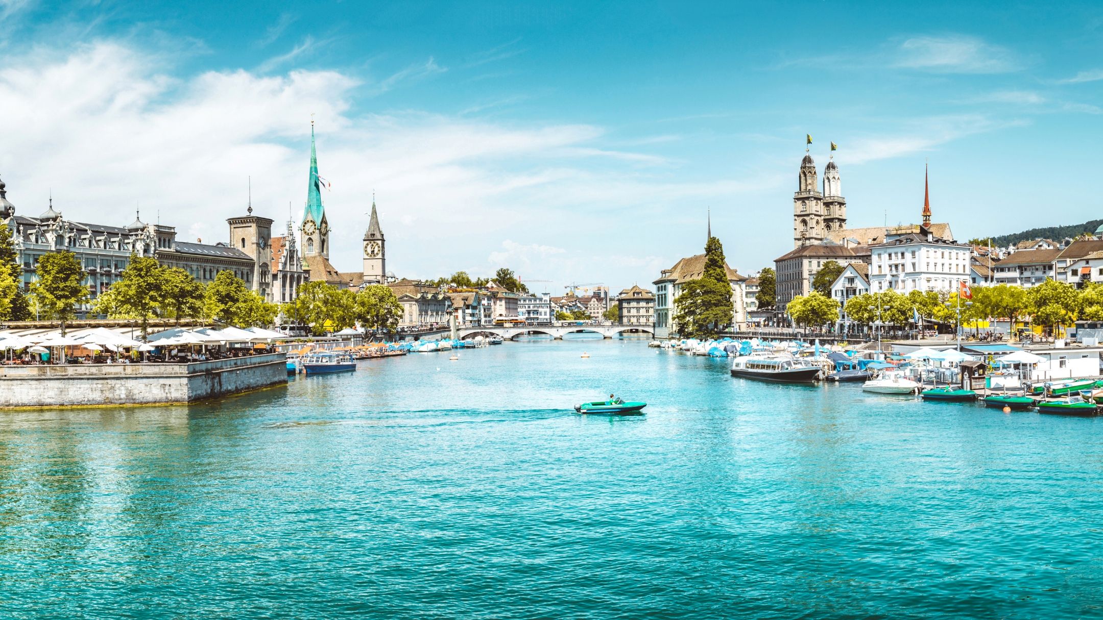 Coopers Care | Coopers Group AG View of the River Limmat, framed by the cityscape of Zurich.